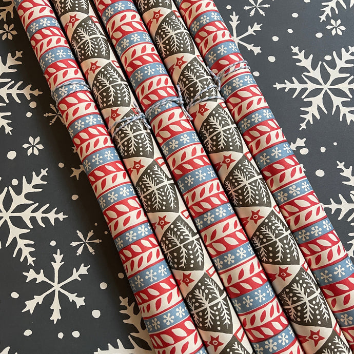 Various coloured Christmas wrapping papers