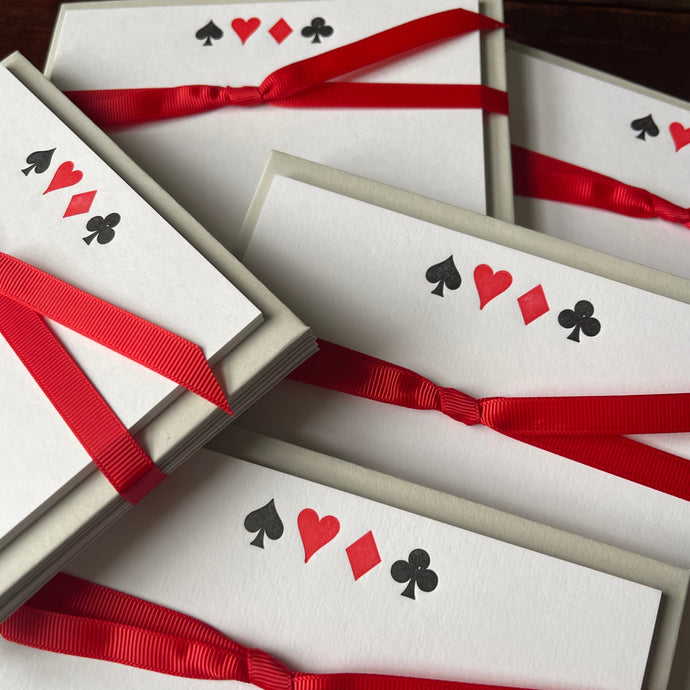 Set of notecards printed with black spade, red heart, red diamond and black club as in a pack of cards, related to playing the game of bridge, 8 cards in a pack with pale grey envelopes