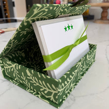 Postcard box in Sprig Pea Green open with a set of notecards with 3 neon  green stars printed on the top