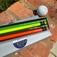 Golf pencil set containing coloured pencils with various text including 'Hole in one!'