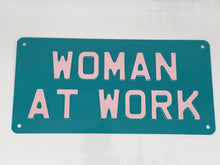 Woman at work sign teal blue and pink